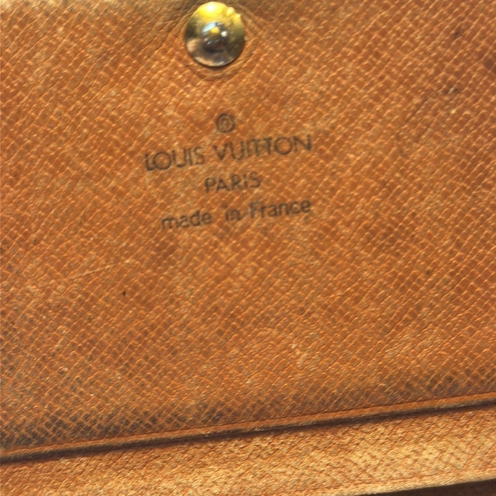 Louis Vuitton billfold. The dimensions are 6 inches wide and 4 inches. Authentic - Picture 3 of 10
